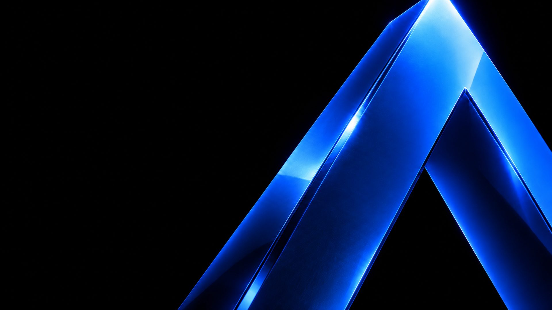 Close view of a glossy cobalt chevron against black. Illustrative image.